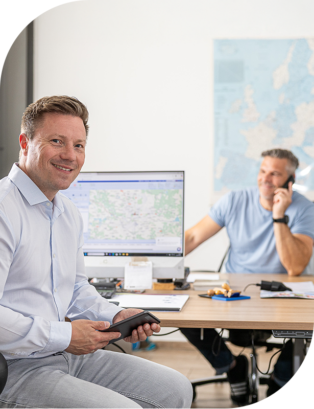 Two men working in modern office with computer